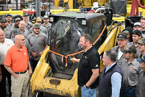 Men stand near a tractor