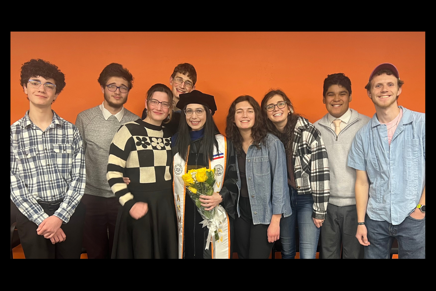 Mel Anderson with her eight children at graduation where she received a PhD