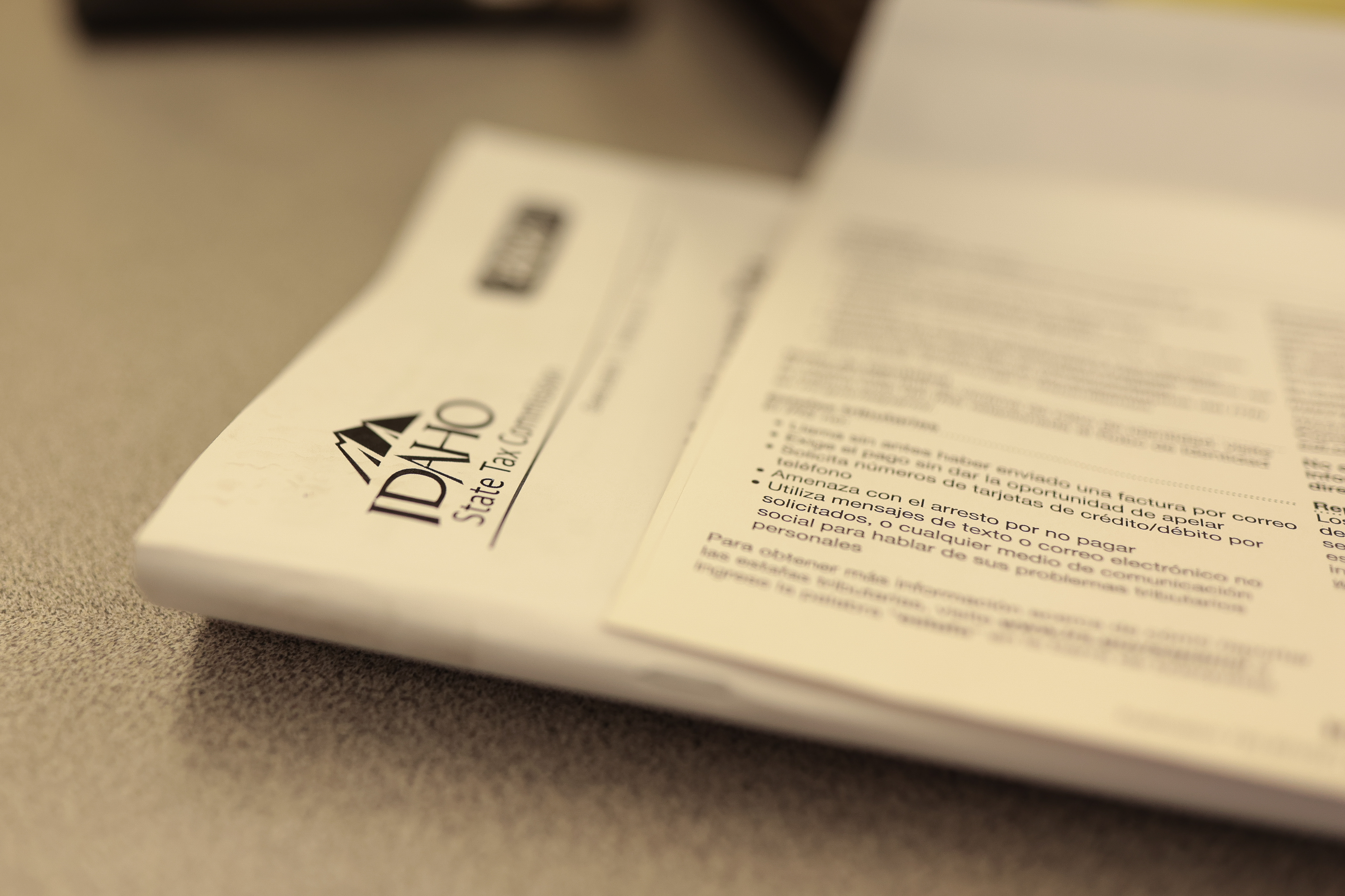 Idaho State tax preparation documents are seen on a table