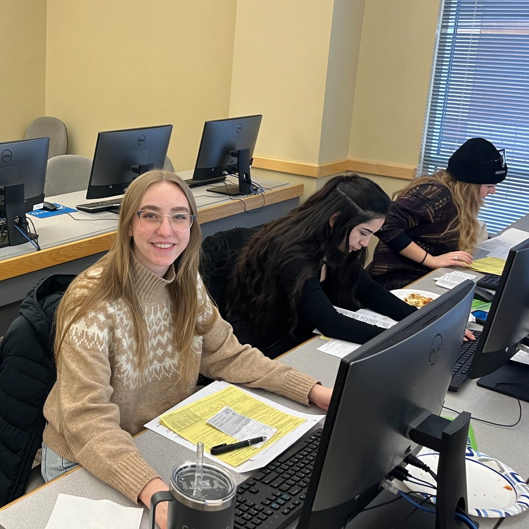 A student prepares taxes at a computer