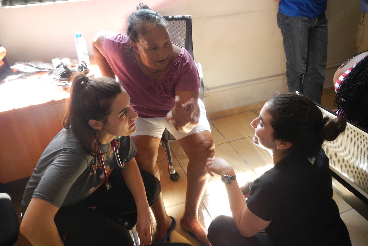 ISU students helping patient