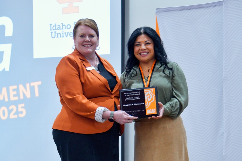 Student receiving an alumni award