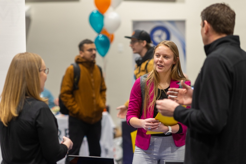 Students discussing remote work