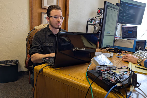 Ethan Freeburne works on a cybersecurity device called a Honeypot