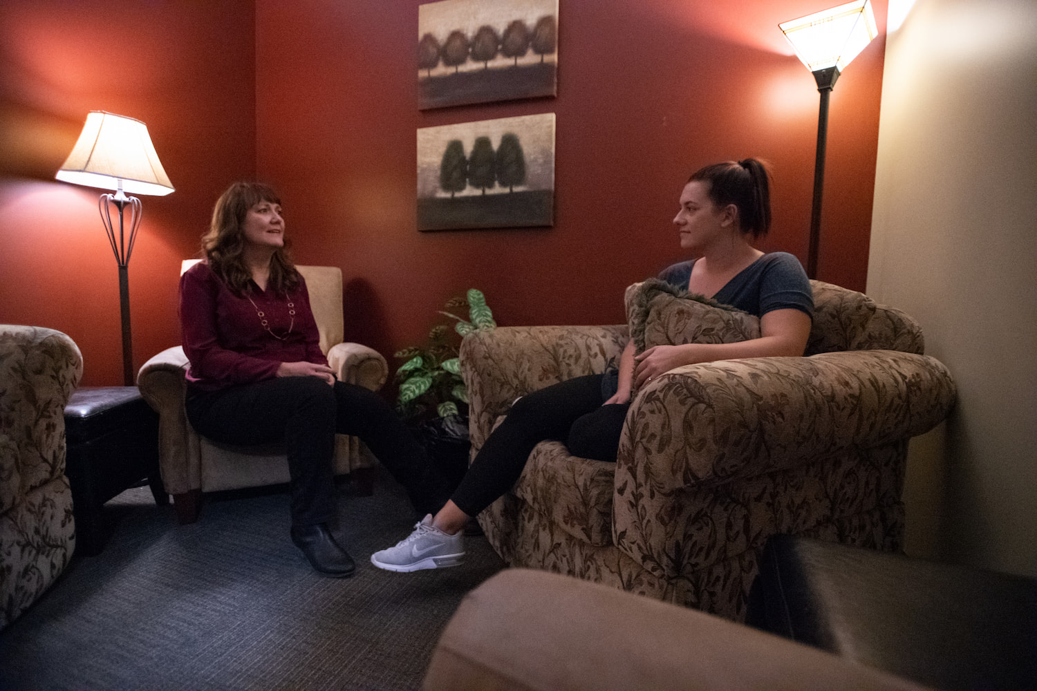 A counselor having a conversation with a woman